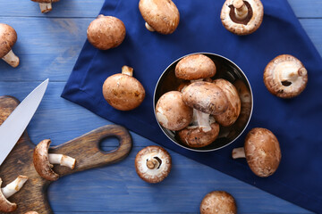 Composition with raw mushrooms on wooden background