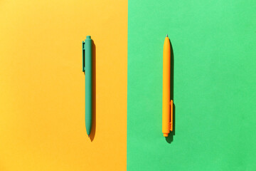 School pens on color background