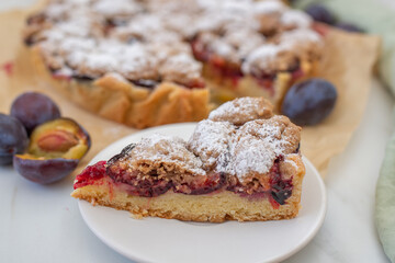 sweet home made plum crumble pie on a table