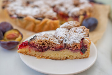 sweet home made plum crumble pie on a table