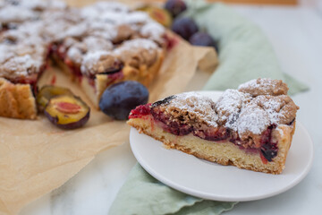 sweet home made plum crumble pie on a table
