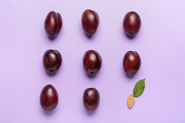 Tasty sweet plums on color background