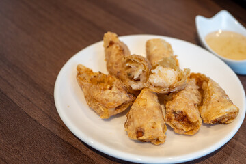Fried shrimp wrapped in a white plate.
