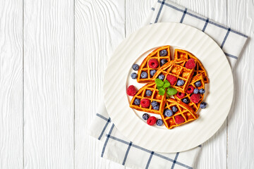 oatmeal banana waffles with berries, top view
