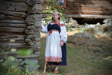 Fototapeta na wymiar Woman wearing Finnish-Ingrian national costume, 