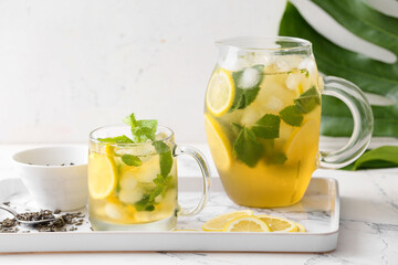 Tasty cold ice tea on table