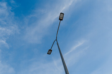 Street lantern on sky background.A modern street LED lighting pole. Copy space
