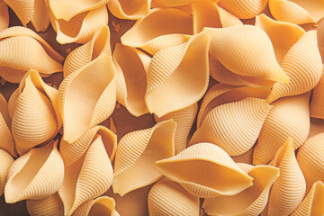 Uncooked conchiglie pasta as background