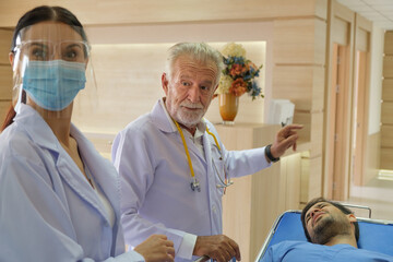 The doctor is inquiring about the symptoms of an emergency room patient