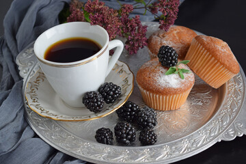 Muffins - delicious pastries. Delicious dessert on the table - homemade muffins. Portioned cupcakes. 