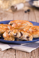 Pastry swirls with cheese and olive filling.