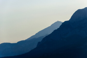 Fototapeta na wymiar Beautiful landscape of blue mountains layers during sunset