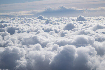 Fototapeta na wymiar above the clouds on cloud 9 in a plane