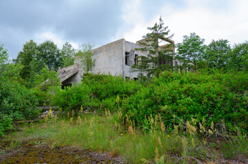 Fototapeta na wymiar Abandoned compound feed plant near resettled village of Dronki in Chernobyl exclusion zone, Belarus