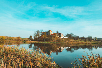 Fototapeta na wymiar view of old european castle lake in front