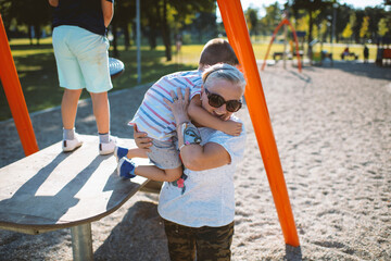 Children having fun with grandmother at the park