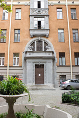 Old courtyard in St. Petersburg. Building's facade. Russian architecture