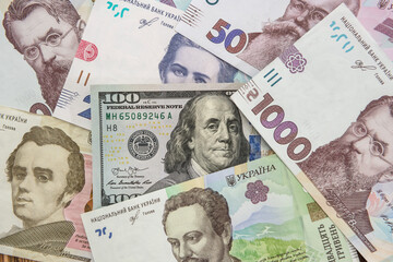 Ukrainian currency hryvnia with usa dollar as background. money exchange concept