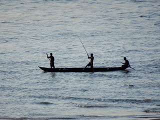 Fisherman fishing on boat in the Mahanadi river at Naraj, Cuttack