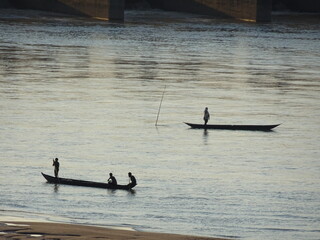 Fisherman fishing on boat in the Mahanadi river at Naraj, Cuttack