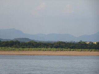 View of Mahanadi river at Naraj making beautiful perfect landscape of river, shore, sand, trees, mountains with different shades
