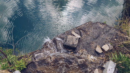 view from above on pond and rock