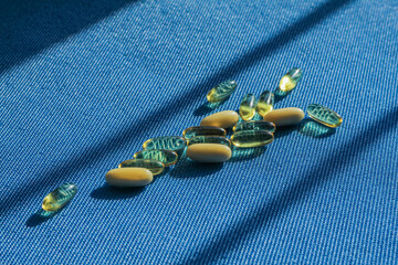 Transparent tablet capsule on blue background with shadows.