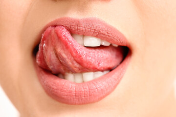 Beautiful young woman with pink lips, closeup