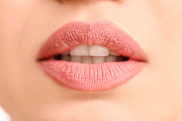 Fototapeta premium Beautiful young woman with pink lips, closeup