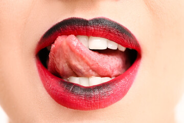 Fototapeta premium Beautiful young woman with unusual makeup, closeup