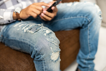 torn on blue jeans