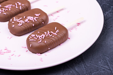 Eskimo ice cream with chocolate on a wooden stick