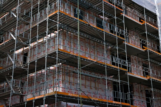 Scaffolding on a construction site building new urban apartments.