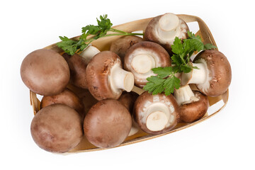 Royal champignon mushrooms in small wooden basket, top view