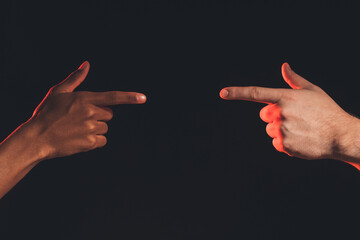 Black lives matter. Races fights. African caucasian male hands pointing finger isolated on dark....