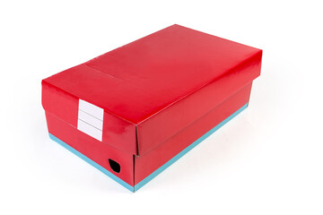 Closed red cardboard shoe box on a white background