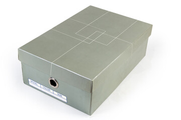 Closed gray cardboard shoe box on a white background