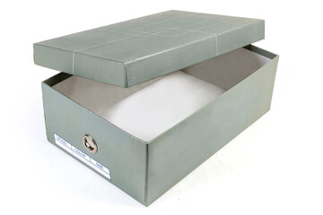Partly open empty gray cardboard shoe box on white background
