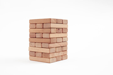Wooden blocks stacked on white background. Accumulation, saving, safety or building in business concept.