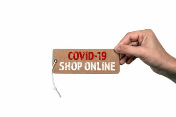 COVID-19 SHOP ONLINE. Price tag with a rope in a woman's hand. Season, shops, online ordering and delivery