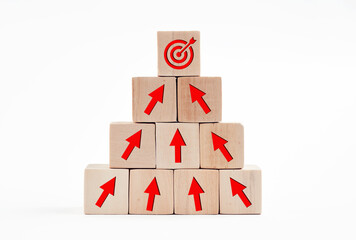 Arrow icons and target icon on wooden cubes. Financial growth, goal achievement or career...