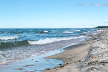 Seascape on the lake Baikal. Froth and waves on wild beach. Summer beach vacation concept. Lifestyle.