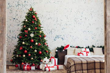 The interior of the bedroom with a green Christmas tree bed with red gifts for the new year decor winter holiday