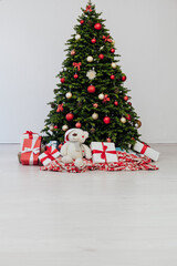 interior of the house with Christmas green Christmas tree decorations and gifts