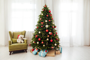 Christmas interior of the white room green Christmas tree with red gifts for the new year decor winter holiday