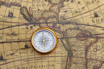 round compass on background of birch bark as symbol of tourism with compass, travel with compass and outdoor activities with compass