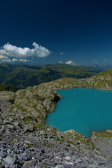 Fototapeta na wymiar Alpiner Bergsee auf dem Pizol in der Schweiz 7.8.2020