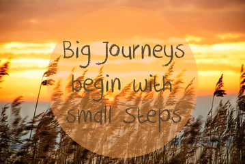 Papier peint photo Citations English Quote Big Journeys Begin With . Beach Grass At Sunrise Or Sunset In Background  © Nelos