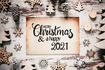 Old Paper With English Calligraphy Merry Christmas And Happy 2021. Vintage White Wooden Christmas Decoration Like Tree