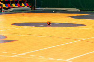 Gym for playing futsal, mini-football. Folded wooden parquet on the field of hall for...